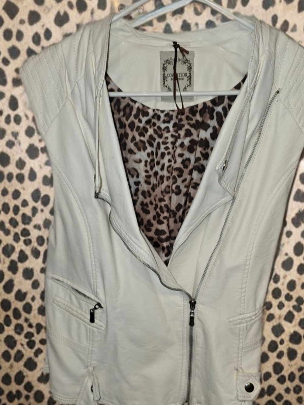 Unleash your wild side with our Light Cream Women's Faux Leather Moto Vest🐆